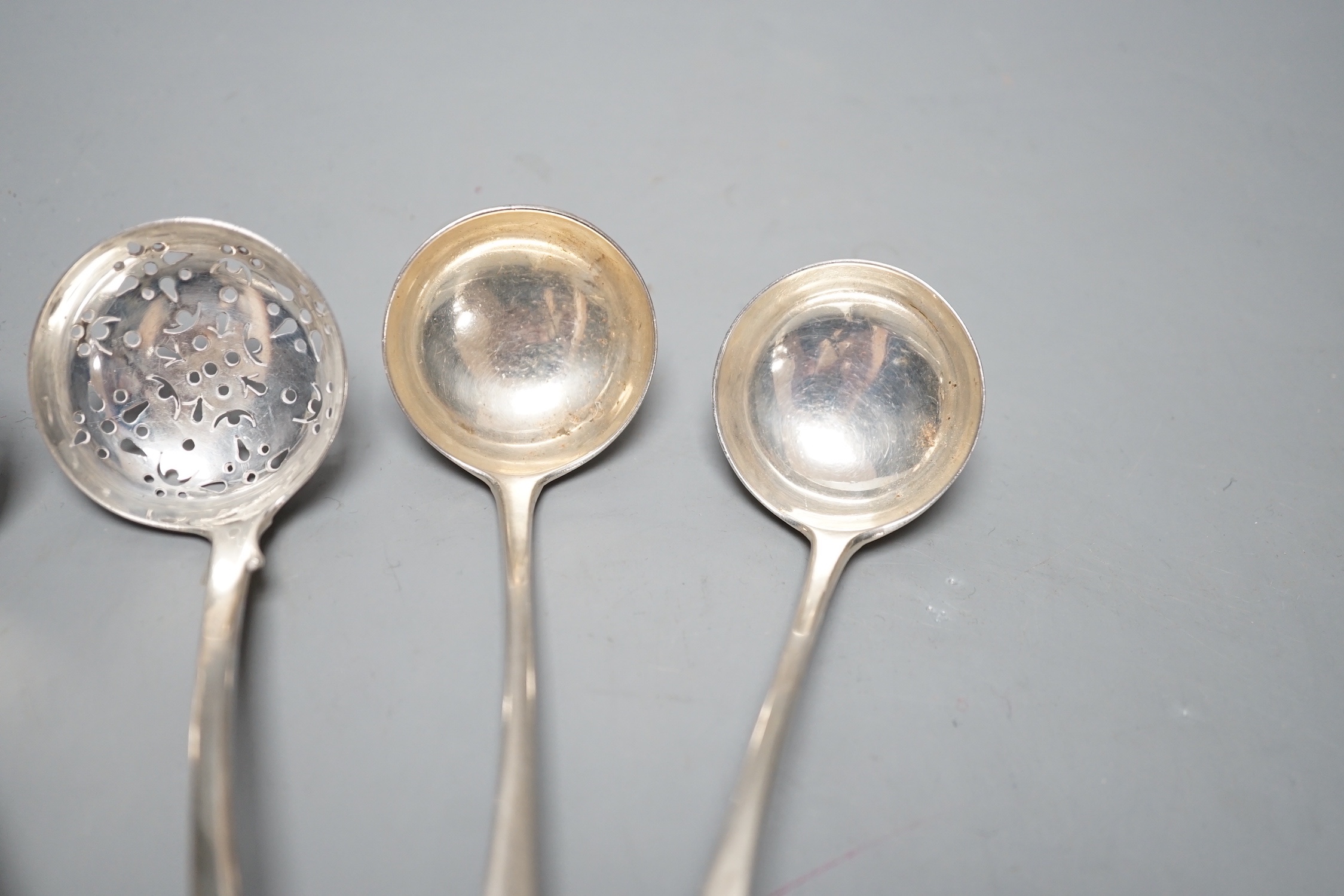 A pair of George III Scottish silver Old English pattern sauce ladles, Edinburgh, 1812, 16cm and a pair of Victorian Scottish silver fiddle pattern sifter spoons, Edinburgh, 1850, 122 grams.